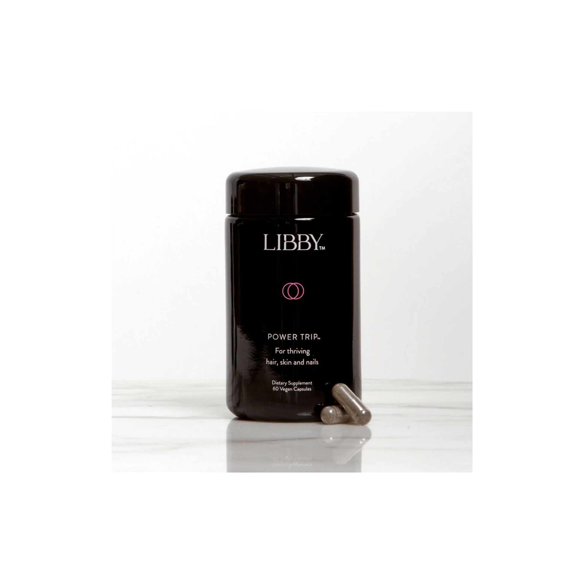 Front view of The Libby System Power Trip 60 capsules jar highlighting the specialized hair skin and nails nourishment formula