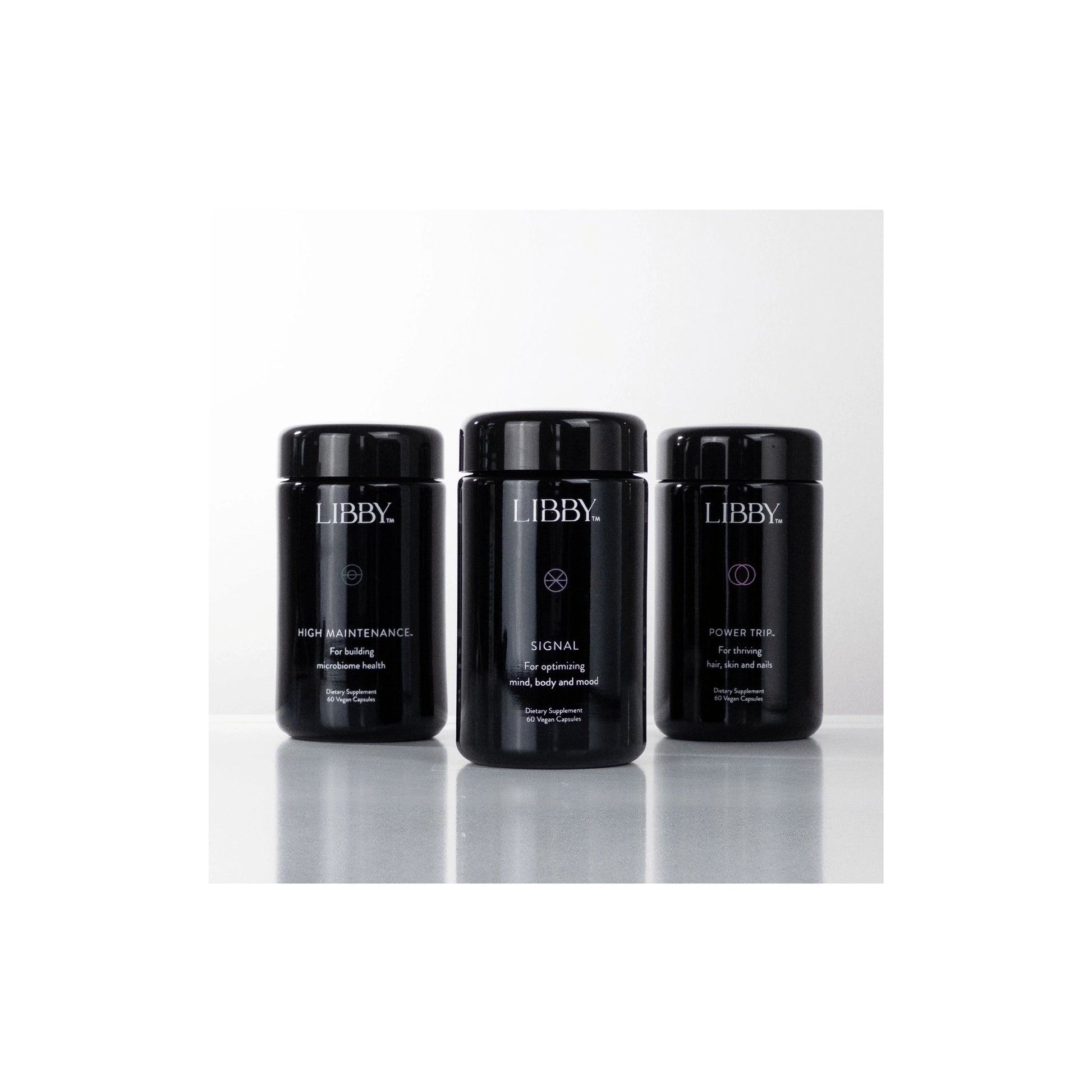Group shot of The Libby System featuring Signal, Power Trip, and High Maintenance jars for complete female wellness support