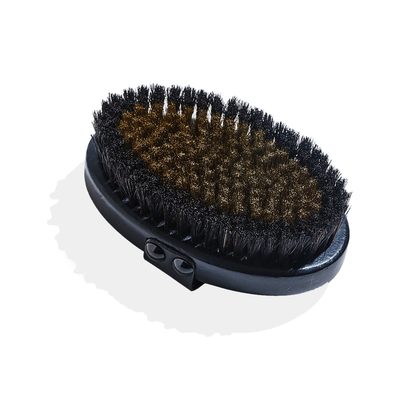 SUPERCHARGE Copper Body Brush with ion-charged copper and natural horsehair bristles on a beechwood board with leather strap for dry brushing and exfoliation.