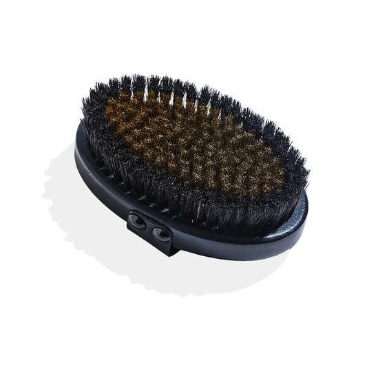 SUPERCHARGE Copper Body Brush with ion-charged copper and natural horsehair bristles on a beechwood board with leather strap for dry brushing and exfoliation.