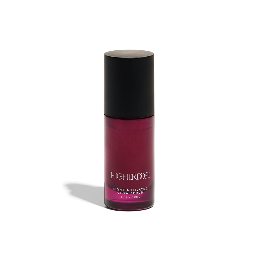 Higherdose Light-Activated Glow Serum bottle for plumping and hydrating radiant skin, 1 oz, pink packaging