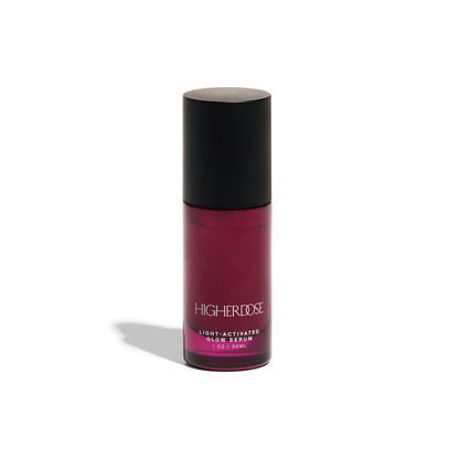 Higherdose Light-Activated Glow Serum bottle for plumping and hydrating radiant skin, 1 oz, pink packaging
