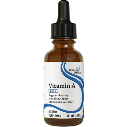 Vitamin A dietary supplement bottle with a dropper on a white background