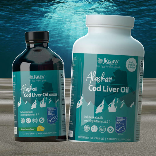 Jigsaw Alaskan Cod Liver Oil liquid and softgel bottles with natural vitamins A and D against ocean background